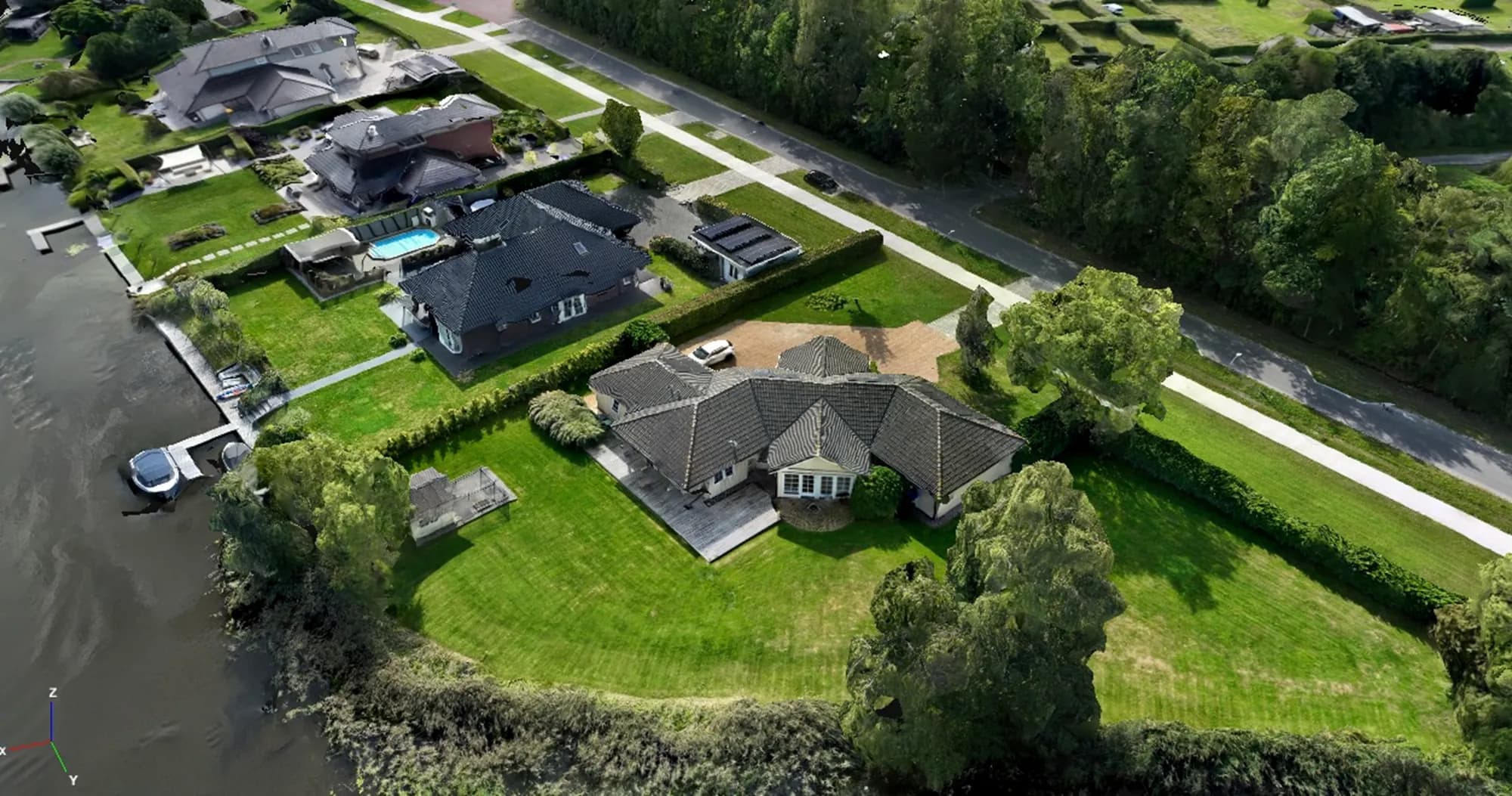 3D-model (textured mesh) van een woning en perceel aan het water in Kropswolde